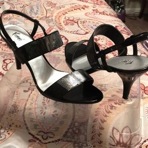 Black and silver high heel Fioni shoes.